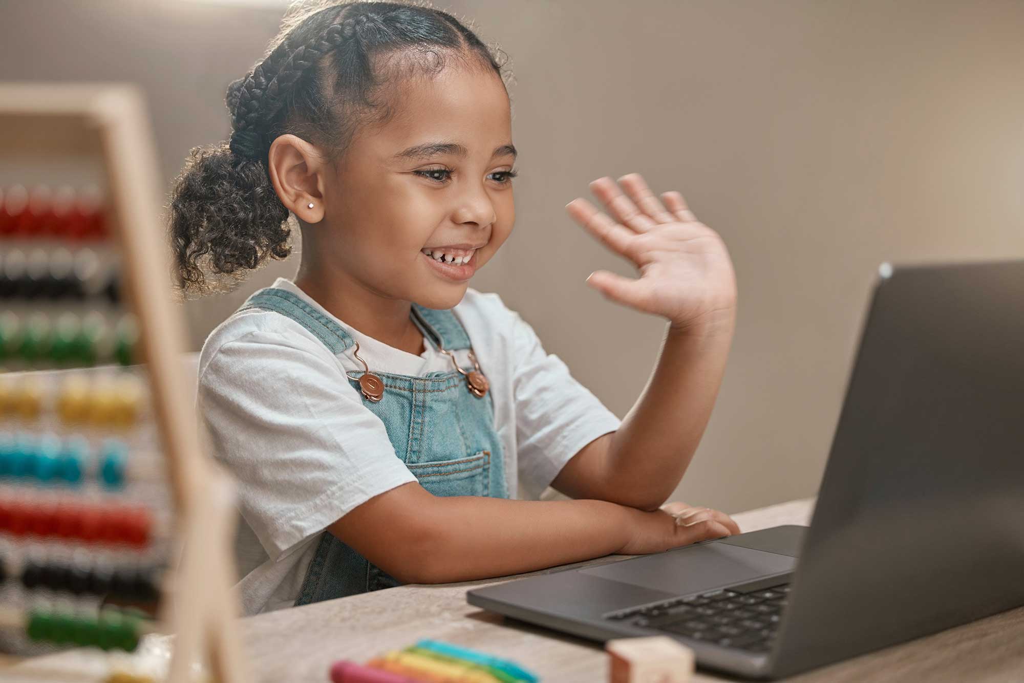 Small child using a laptop