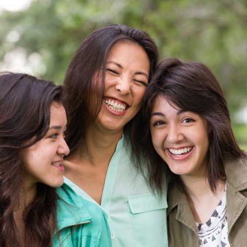 neuropsychological-testing Parent and two siblings smiling
